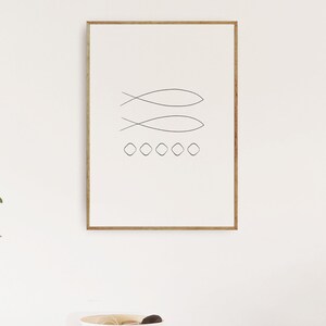 May include: A framed minimalist line art print with two fish symbols and a row of five circles. The print is on a white background and has a light brown wood frame.