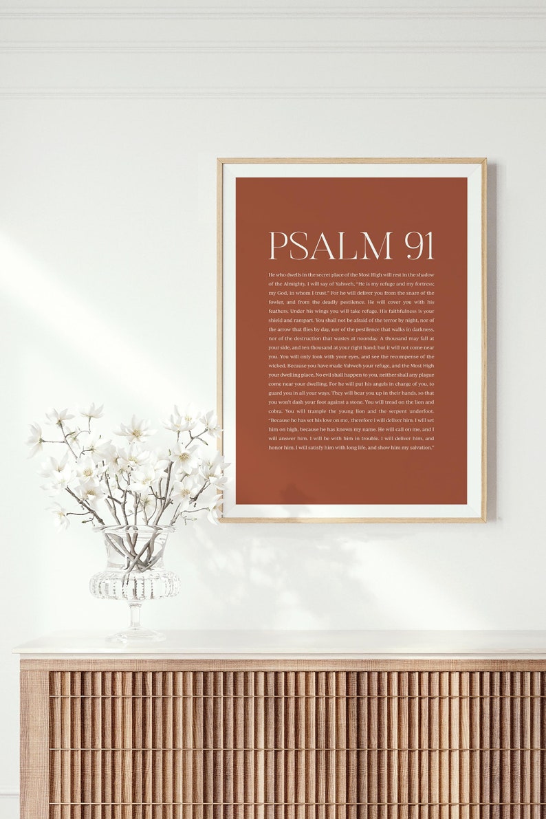 May include: A printable wall art poster with a brown background and white text. The poster features the text "PSALM 91" in a large font at the top and a passage of scripture from the Bible below.
