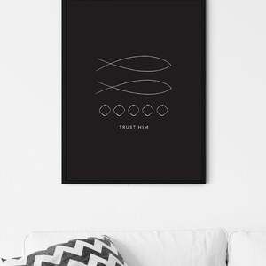 May include: Black and white minimalist art print with two stylized fish symbols and the text "TRUST HIM" in a white sans-serif font.