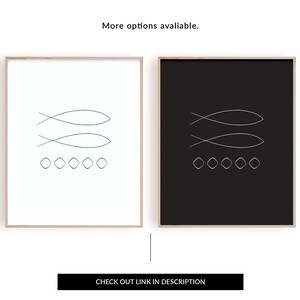 May include: Two minimalist black and white prints with a line drawing of two fish and a row of circles. The prints are framed in a light wood frame.