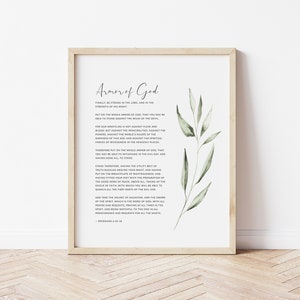 K&ouml;nnte beinhalten: Ein druckbares Wandbild mit einem Zitat &uuml;ber die R&uuml;stung Gottes aus Epheser 6,10-18. Das Zitat ist in schwarzer Schrift auf wei&szlig;em Hintergrund gedruckt, mit einer Aquarell-Illustration von gr&uuml;nen Bl&auml;ttern in der Ecke.