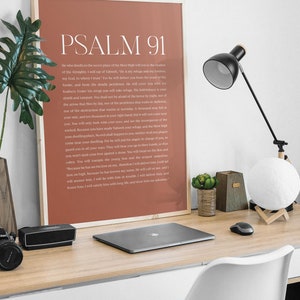 May include: A printable wall art poster with a brown background and white text. The poster features the text "PSALM 91" in a large font at the top and a passage of scripture from the Bible below.