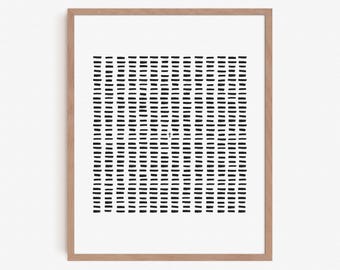 May include: Black and white abstract geometric print with a grid pattern of short lines. The print is framed in a light wood frame.