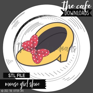 May include: A cartoon-style yellow shoe with a red polka dot bow, set against a white circular background. The image includes the text "STL FILE mouse girl shoe" and "the cafe DOWNLOADS".