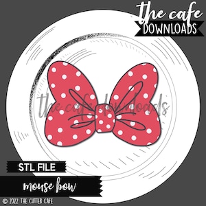 May include: A red and white polka dot bow with a white center. The bow is in the shape of a traditional bow with two loops and a center knot. The bow is on a white background with a black and white pattern.