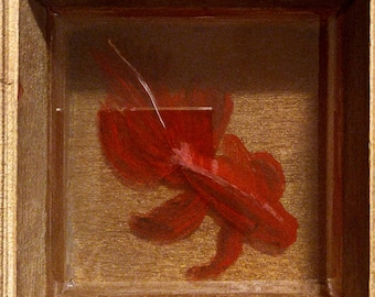 May include: A red goldfish painted in a wooden frame with a glass front.