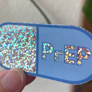 May include: A blue and silver pill-shaped sticker with the word "PrEP" in glittery letters.