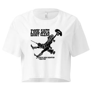 May include: White crop top with a black graphic featuring a woman with a syringe and cowboy hat, and the text "FUCK SAFE SHOOT CLEAN" and "AUSTIN HARM REDUCTION COALITION".