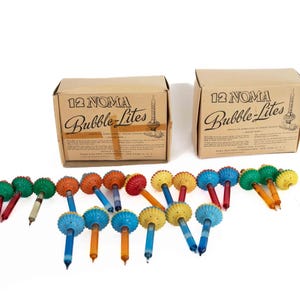 Noma Bubble-Lites Call Biscuit lights 12 working lights in the box 1 single light.