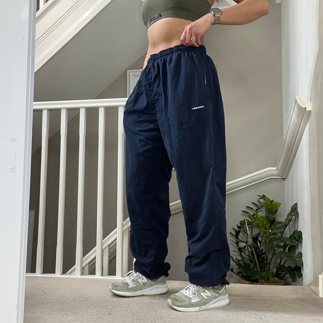 Reebok blue track pants sales