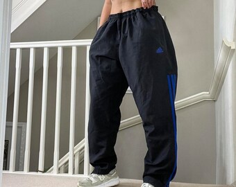 Adidas pants black with blue deals stripes