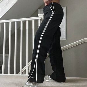 Nike sweatpants with white stripe 2025