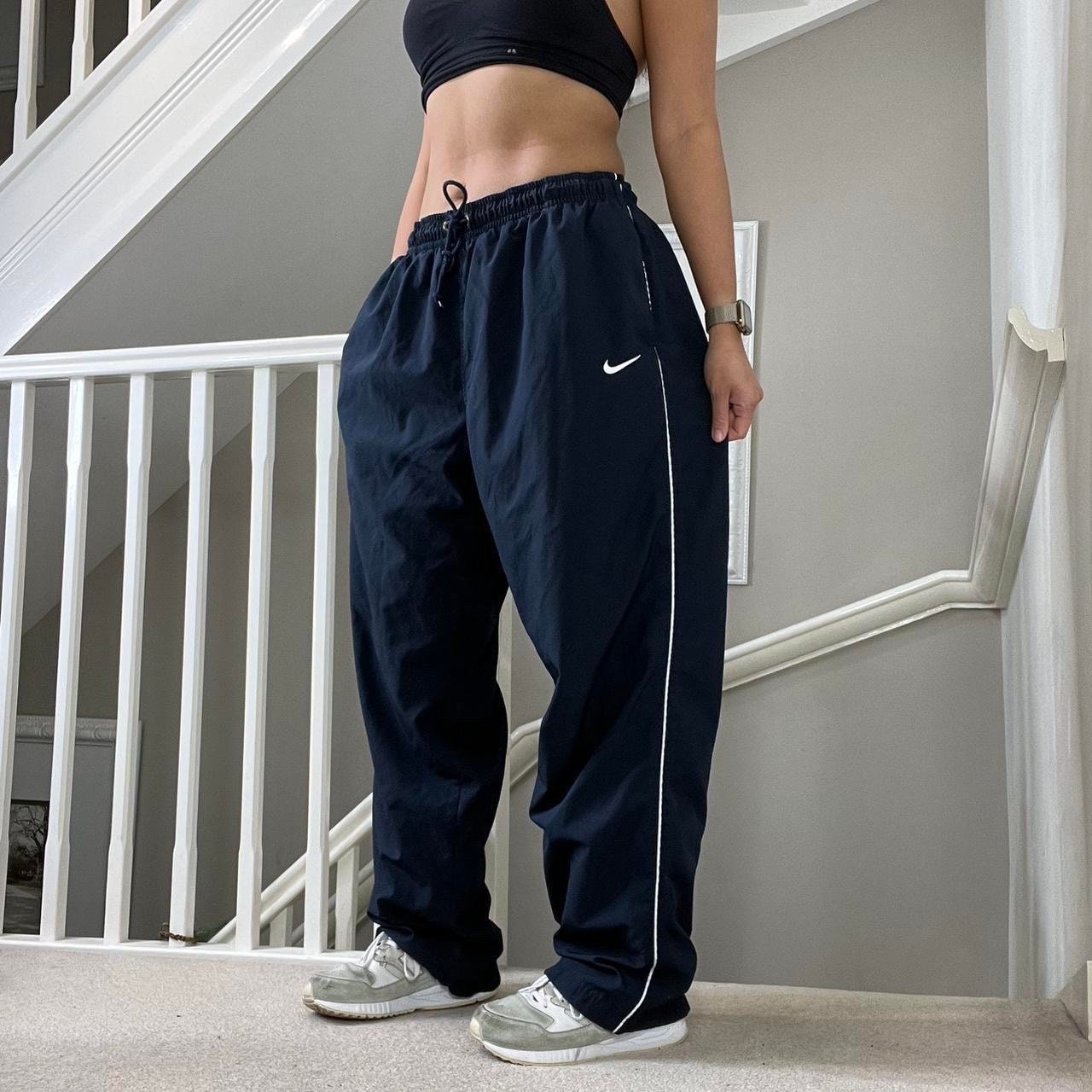 Nike shiny tracksuit bottoms hotsell