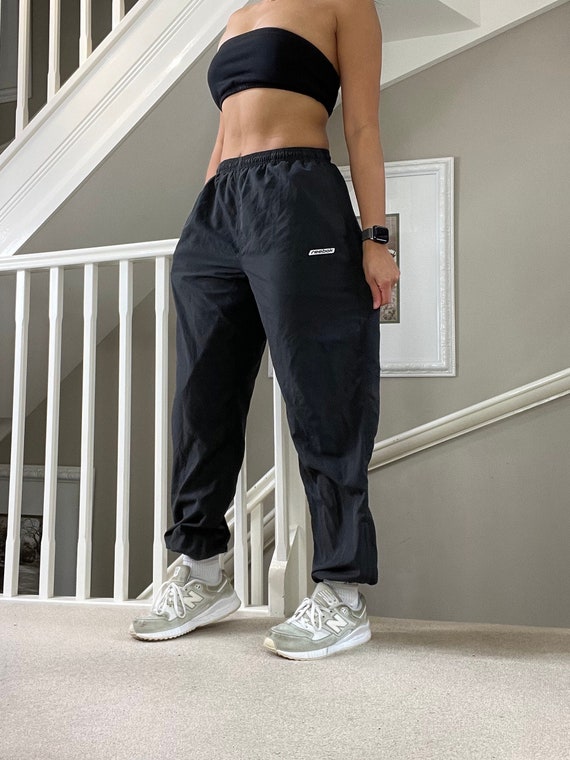 Reebok black track pants sales