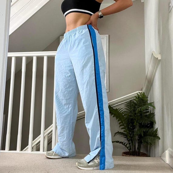 Light blue nike track pants sale