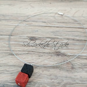 Stainless steel necklace choker with a pendant made of coral and lava in cube shape