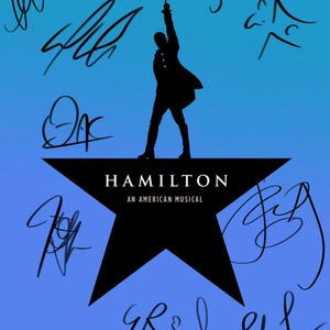 May include: A black silhouette of a person standing on a black star with the words "Hamilton An American Musical" written on it. The background is a gradient of blue and light blue with black signatures surrounding the star.