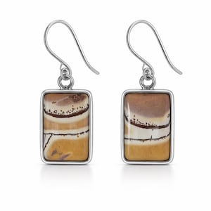 May include: A pair of rectangular earrings with a silver-colored frame. The earrings feature a natural stone with horizontal bands of brown, tan, and white. The earrings have a hook closure.