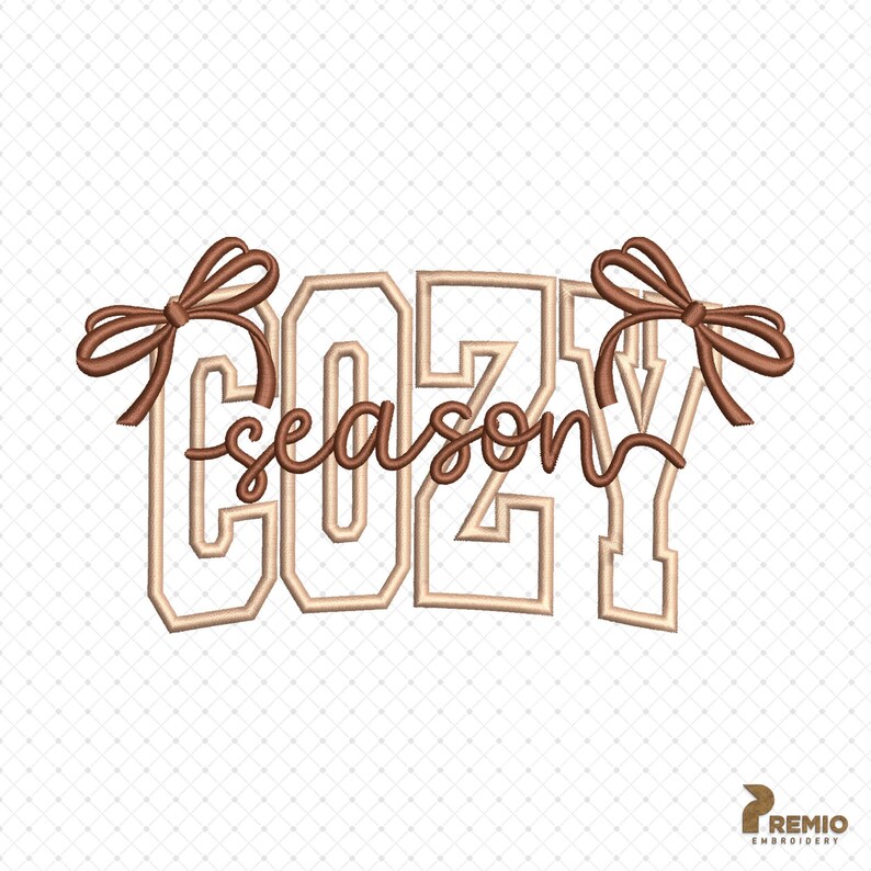 May include: An embroidered design featuring the words "COZY season" in a beige, collegiate-style font. The word "season" is in a cursive font. Two brown bows are positioned above the letters "C" and "Y". The design is on a white background.