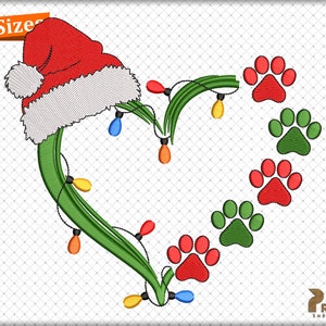 May include: Green heart-shaped wreath with red and green paw prints and a red Santa hat with white trim. The wreath is decorated with a string of colorful lights.