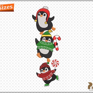 May include: Three penguins wearing winter hats and scarves, one holding a candy cane and another holding a candy. The penguins are stacked on top of each other.