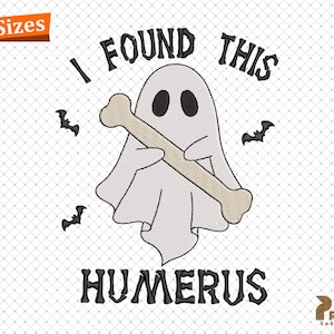 May include: An embroidered design featuring a cartoon ghost holding a bone, with the text "I FOUND THIS HUMERUS". The design includes bats and a banner that says "4 Sizes".