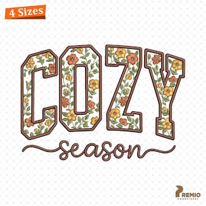 May include: An embroidered design with the words "COZY season" in a collegiate font. The letters are filled with a floral pattern in orange, yellow, and green, outlined in brown. The design includes a small corner graphic that says "4 Sizes".