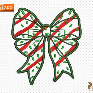 May include: An embroidered bow design featuring red and white stripes, green accents, and green sprinkles. The bow is outlined in green. The text "4 Sizes" is in the upper left corner. The design is on a white background.