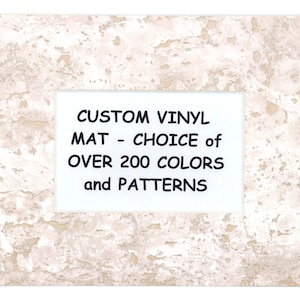 May include: A white textured frame with a white rectangle inside. The rectangle contains the text "CUSTOM VINYL MAT - CHOICE of OVER 200 COLORS and PATTERNS".