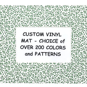 May include: A white background with a green leafy pattern. A white rectangle with black text reads "CUSTOM VINYL MAT - CHOICE of OVER 200 COLORS and PATTERNS".