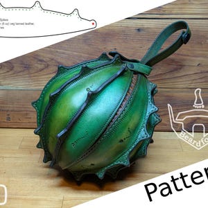 May include: A handcrafted green leather bag with a unique spiky design. The bag features a handle and is made from veg-tanned leather. The word "Pattern" is visible in the image.