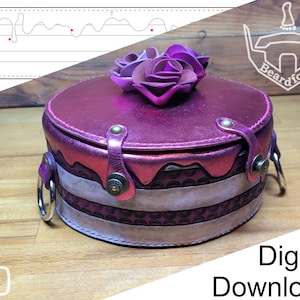 May include: A round, metallic magenta leather box with a lid featuring three sculpted leather roses. The sides have a layered, cake-like design with embossed patterns, secured by two metallic straps with studs and silver-toned side rings.