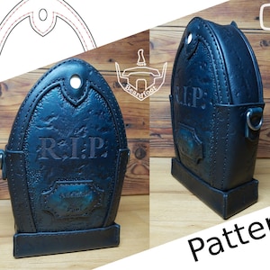 May include: A black leather bag shaped like a tombstone with the words "R.I.P." embossed on the front. The bag has a strap and a small pocket on the side.