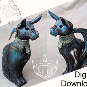 May include: A dark blue and black leather cat sculpture with pointed ears, a decorative collar featuring a light blue stone, and intricate stitching. The figure displays a textured finish and includes the text Beardfoot and Digital Download.