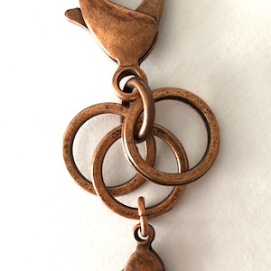 Tether, a stitch marker and charm holder.