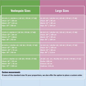 May include: Size chart with measurements in inches and centimeters for clothing sizes, including XS, S, M, L, XL, 0X, 1X, and 2X. The chart includes chest, waist, and hip measurements.