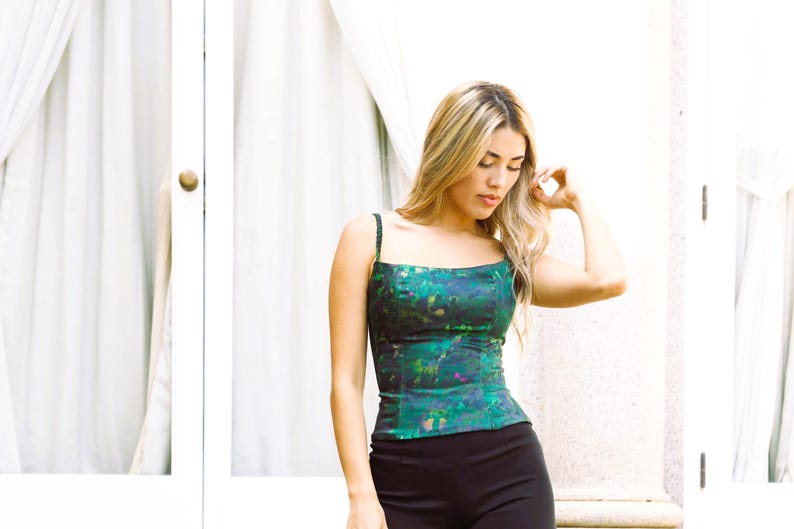 Evening Glow
Satin Party Bustier
As seen on the model, this structured bustier is the ultimate night-out essential. Its glossy finish captures the light, while the internal boning defines the torso with maximum precision.