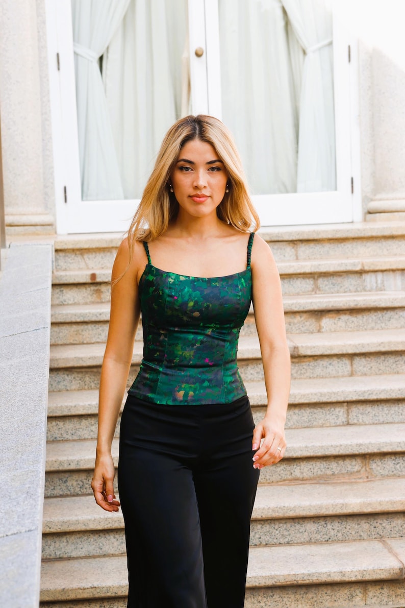 Defined Neckline
Square Neck Formal Blouse
The model highlights the square neckline, designed to visually elongate the neck and showcase jewelry. A minimalist piece that fits like a second skin thanks to its technical design.