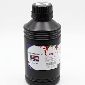 May include: A black plastic bottle containing 500ml of UV curable LED hard ink. The label features a graphic of colorful paint splashes, an American flag icon, and the text "UV CURABLE LED INK" and "HARD INK" with usage instructions.