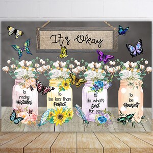 May include: Four mason jars with floral arrangements and butterflies. Each jar has a different inspirational quote: "to make mistakes", "to be less than perfect", "to do what's best for you", and "to be yourself". The jars are on a gray background with a sign that says "It's Okay".