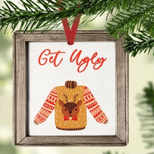 May include: A wooden framed ornament with a white background and the text "Get Ugly" in red glitter. A cartoon reindeer wearing a bow tie is on a brown sweater with a red and white patterned design.