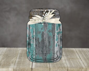 May include: A rustic mason jar with a distressed teal blue and gray woodgrain design. The jar is tied with a white ribbon and has a sprig of white flowers.