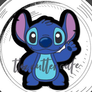 May include: A blue and purple Stitch character cookie cutter. The cutter is in the shape of the character, with a light blue belly and large eyes. The cutter is on a white plate with the text "the cutter cafe" and "standing experiment".