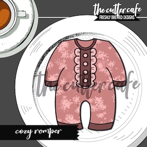 May include: A pink baby romper cookie cutter with a floral pattern and a ruffle trim. The cutter has four brown buttons and the text "cozy romper" is below the cutter.