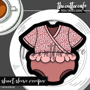 May include: A pink and white short-sleeved romper with a ruffled bottom. The romper has a wrap-style top and a polka dot pattern. The text "short sleeve romper" is printed below the image.