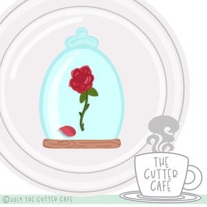May include: A glass dome with a single red rose inside, a single red rose petal on the base, and a wooden base. The dome is on a white plate with a gray and white pattern. The text "THE CUTTER CAFE" is on a gray coffee cup with steam coming from the top.