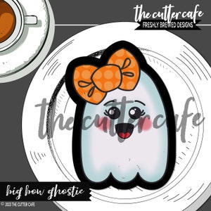 May include: A white ghost cookie cutter with a big orange bow with white polka dots. The ghost has a happy face with rosy cheeks and big eyes. The text "big bow ghostie" is at the bottom of the image. © 2023 The Cutter Cafe