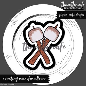 May include: Two brown and white marshmallows on sticks, crossed over each other, on a white plate with a black outline. The text "roasting marshmallows" is below the plate.