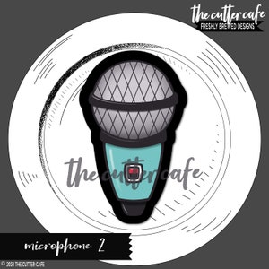 May include: A teal blue microphone with a black grill and a red button. The microphone is in a circle with a black and white sketch of lines around it. The text "the cutter cafe" is at the top of the image and the text "microphone 2" is at the bottom of the image.
