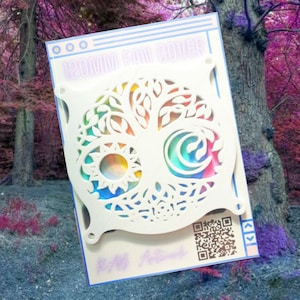 May include: White 120mm fan cover with a tree of life design. The cover has a cut-out pattern revealing a colorful rainbow background. The text "120MM FAN COVER" is at the top, and "RAB Artwork" is at the bottom.